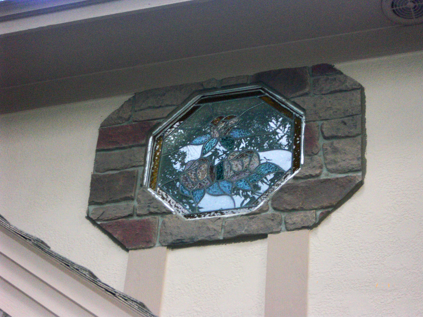 The panels are easy to cut, which allowed the homeowners to accent this stained glass window in cobblestone.