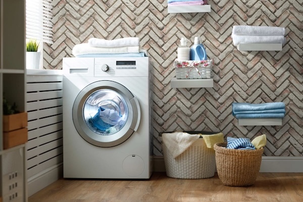 Old Chicago Herringbone Faux Brick Wall Panels in Cream Caramel installed on a laundry room wall