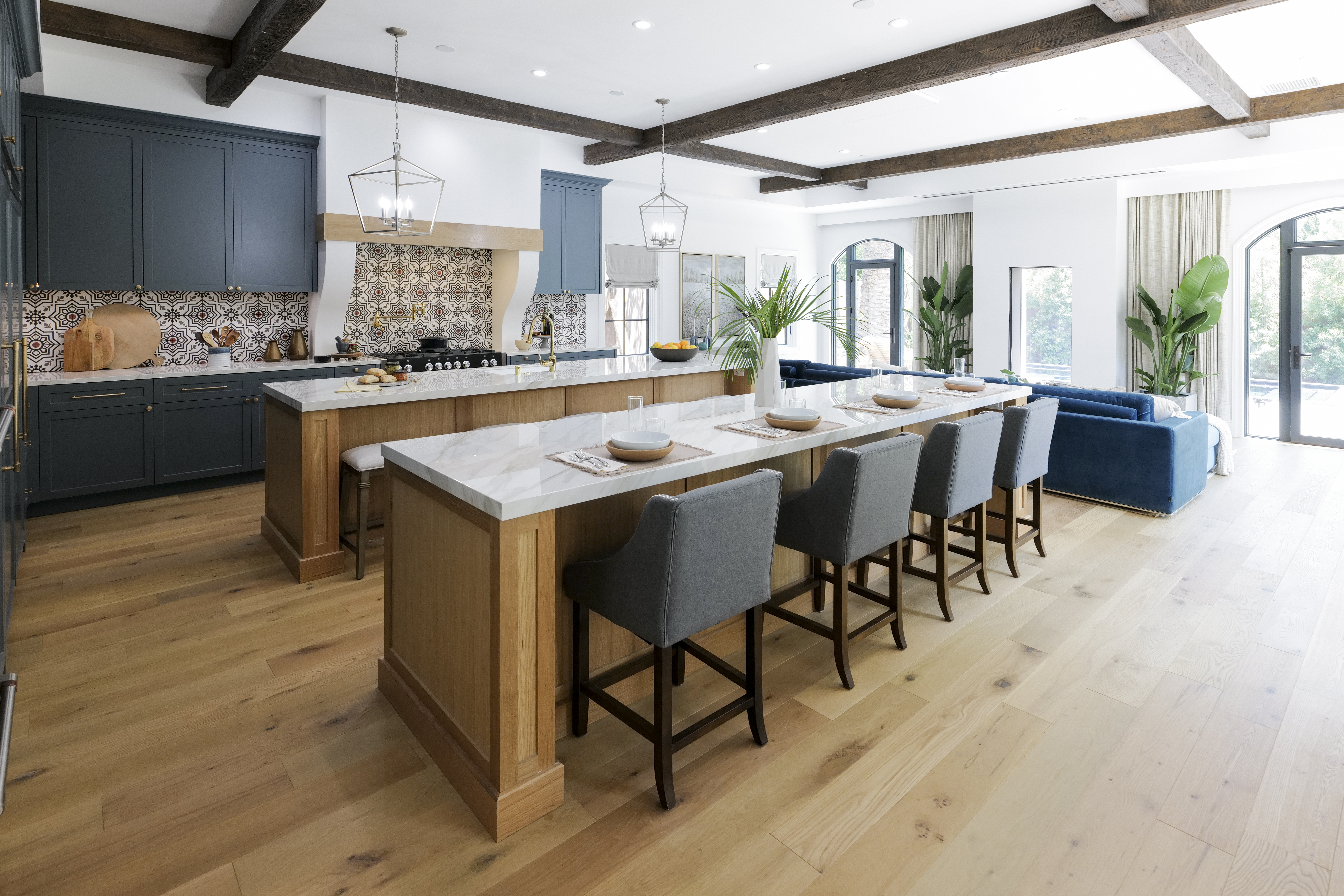 A wide grid coffered ceiling crafted out of faux wood beams in a homey kitchen