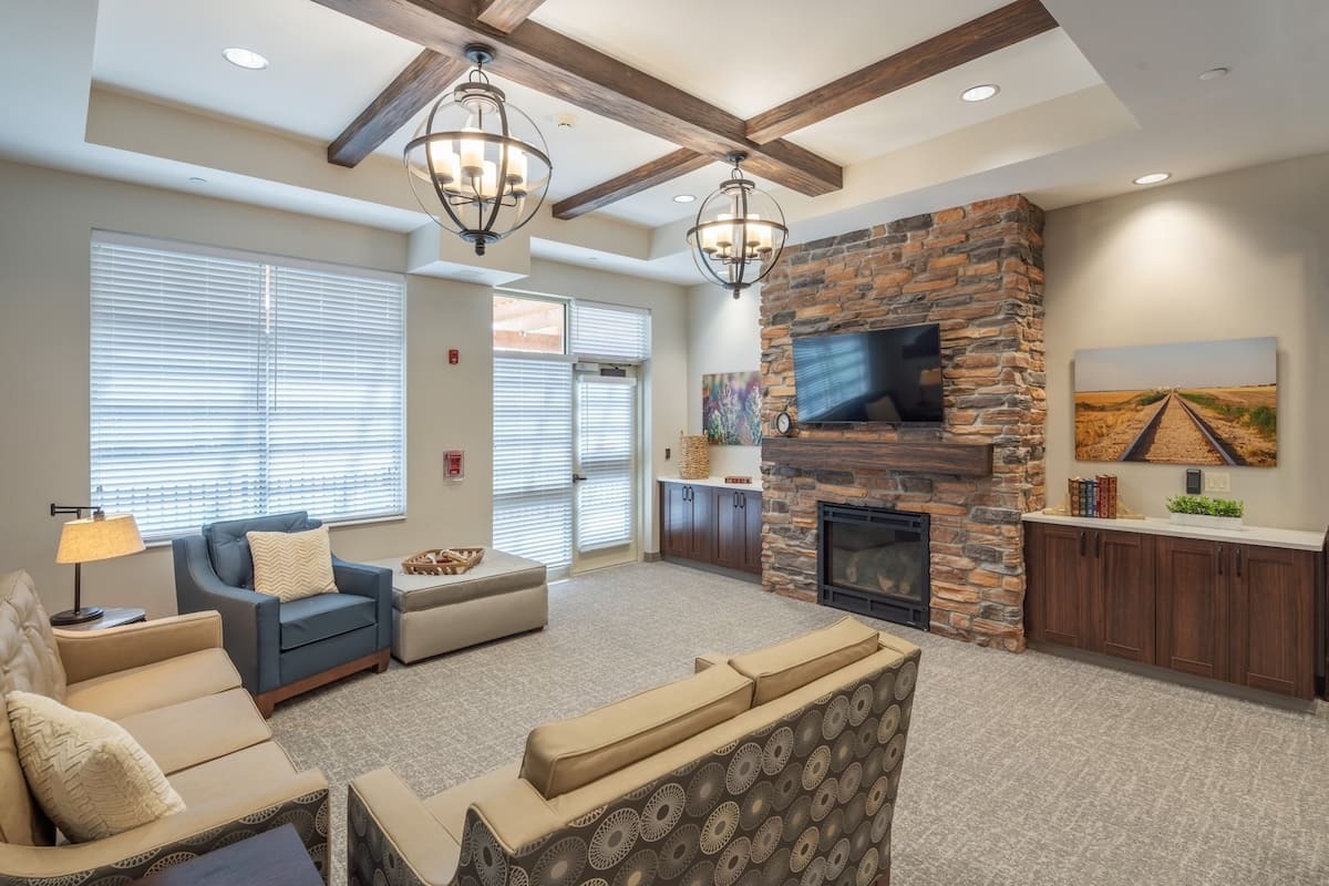 Dark Walnut Heritage faux wood beams adding residential comfort to commercial seating area