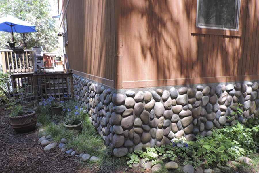 Faux river rock wall panels on a home's exterior