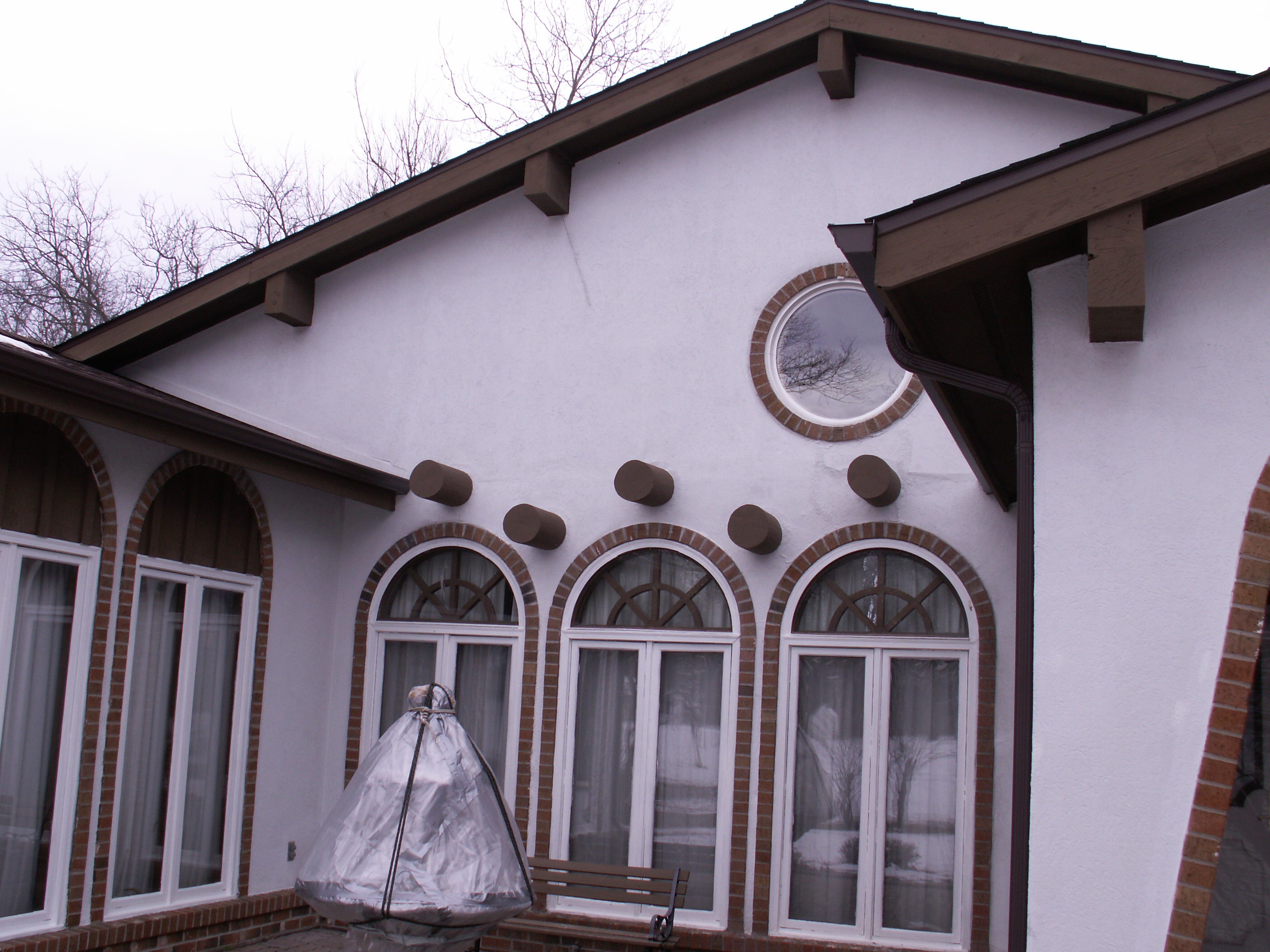 Faux wood corbels add a recognizable southwest architecture design element to a modern southwest style home.