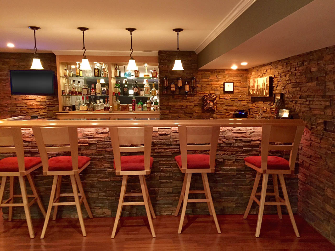Somerset Dry Stack faux stone panels installed in a home bar.