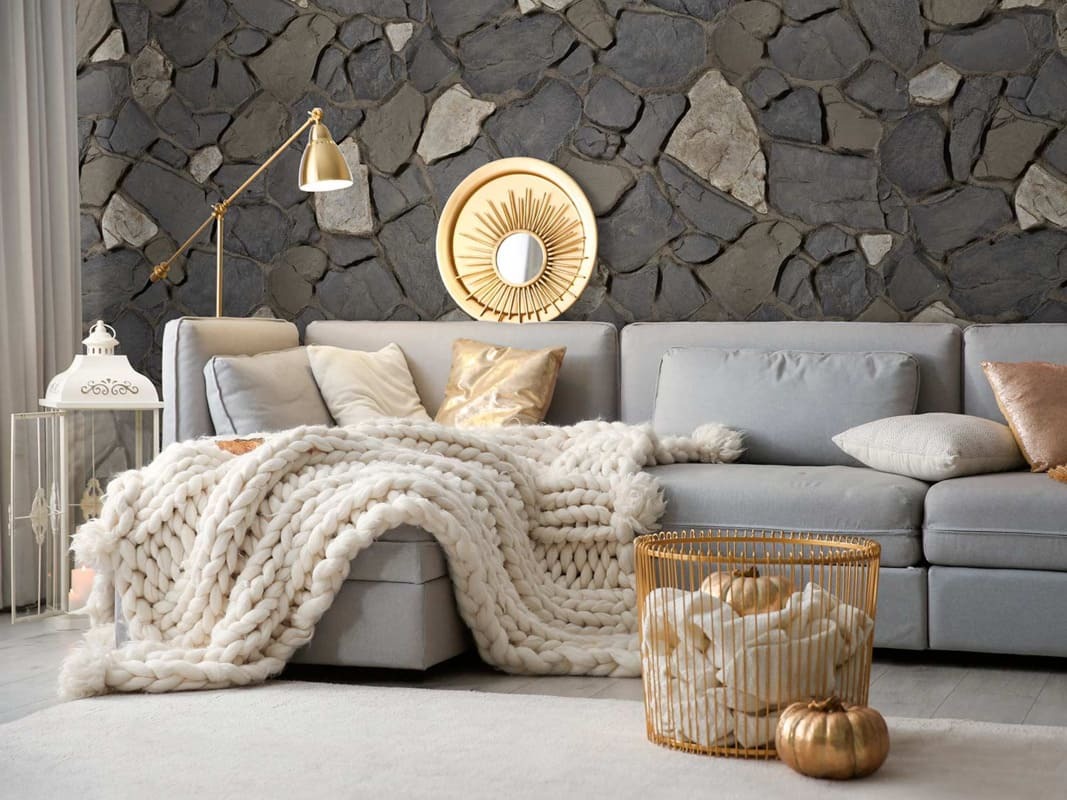 Anson Fieldstone Faux Stone Wall Panels in Mist installed in a living room