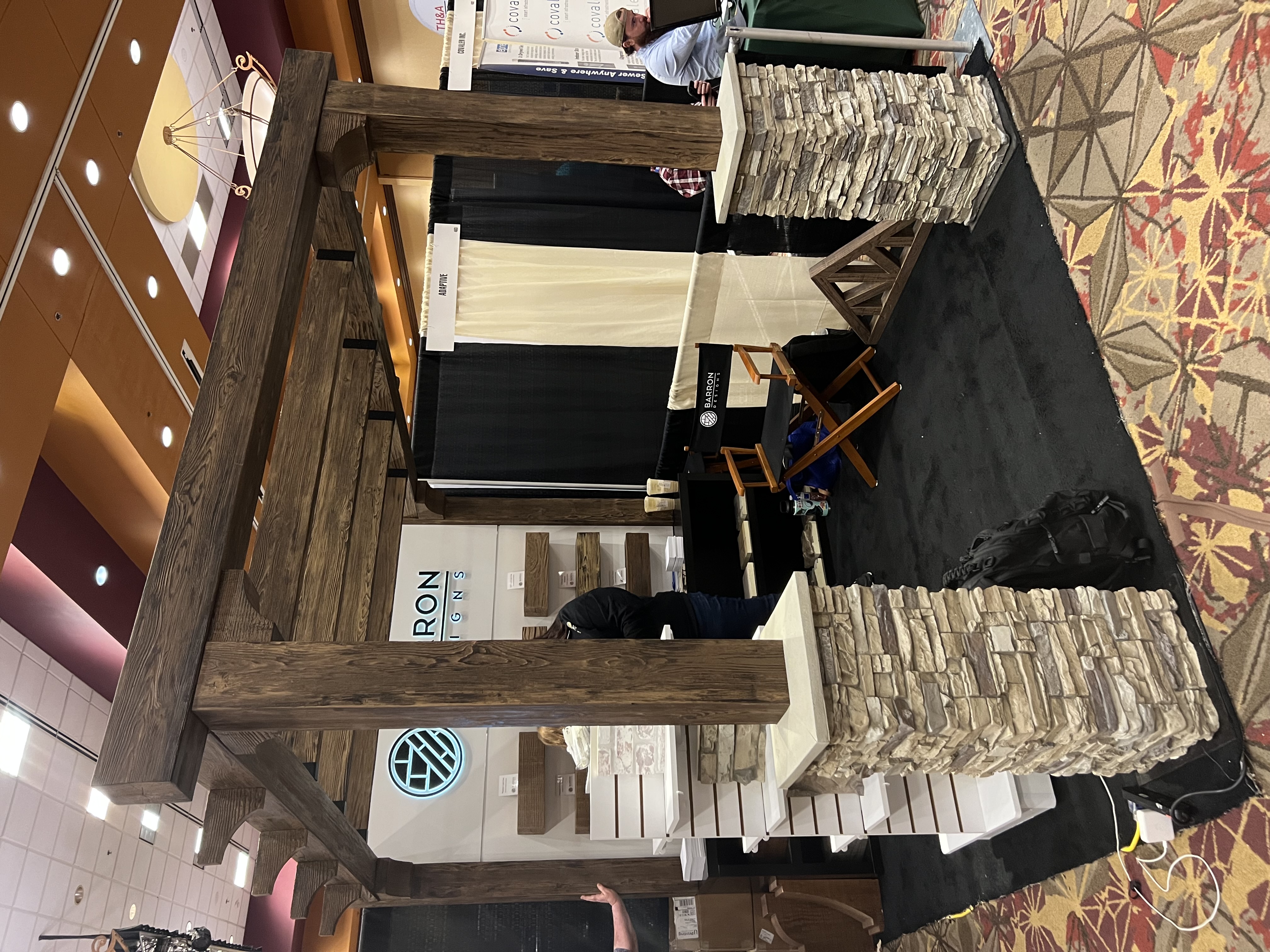Lightweight stone veneer and faux wood beams are a great way to add visual appeal to your trade show booth.