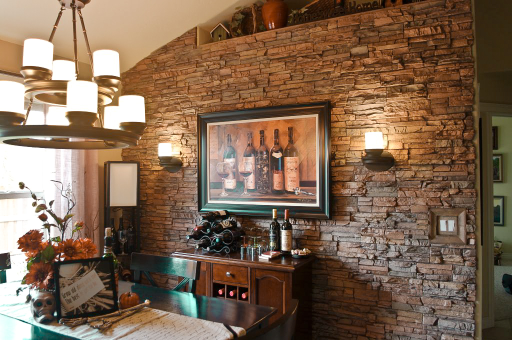 A Colorado Dry Stack Faux Stone Panel accent wall in a  dining room