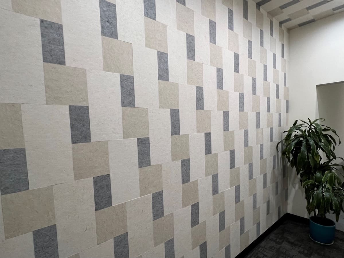 Light gray, beige, and charcoal FSorb panels creating a feature wall