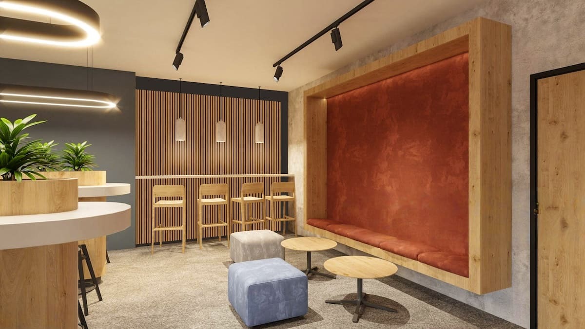 Maple slat wood acoustic panels improving the sound and residential feel of a corporate kitchen area