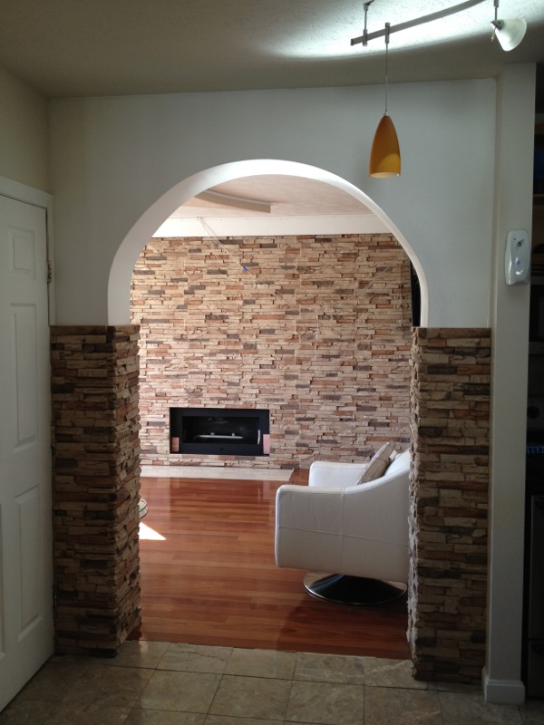 Decorative stone column wraps adding rustic charm to a home's interior