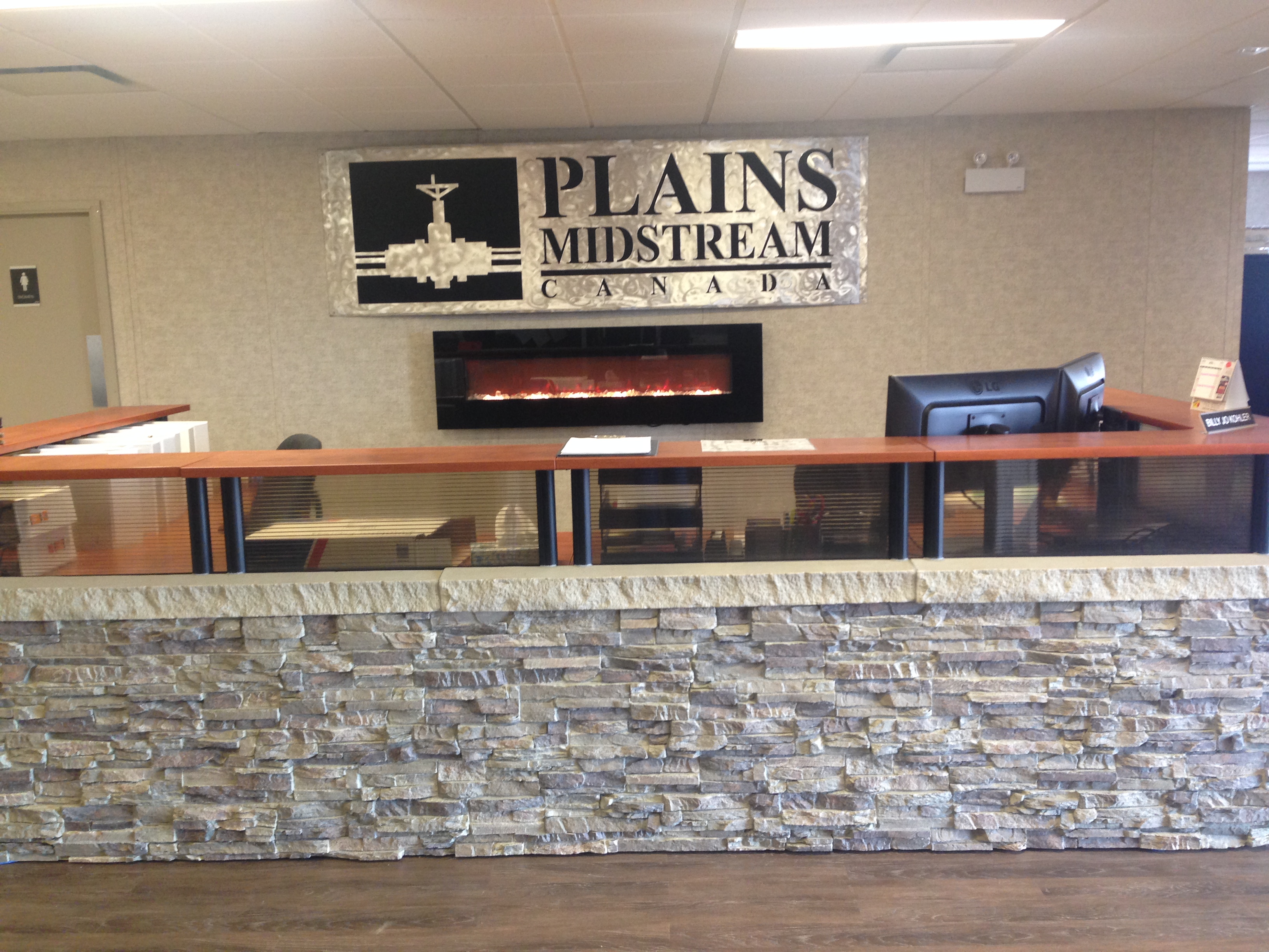 Receptionist's desk outfitted with Colorado stacked stone panels