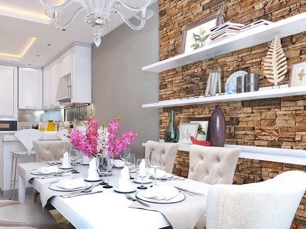 Colorado Dry Stack Faux Stone Wall Panels in Sierra Brown installed as an accent wall in a dining room