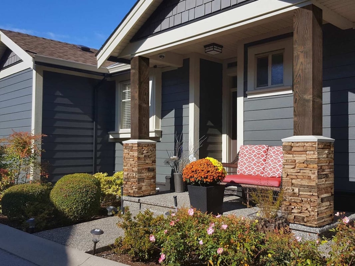 Colorado Dry Stack Stone Column Wraps in Sierra Brown & Barn Board Column Wraps in Charred Brown