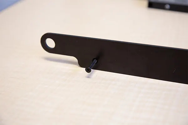 Use the M4X16 machine tapping screws to affix the Soft Stop to the bracket.