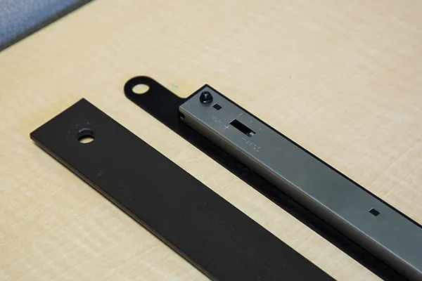 A Soft Stop and bracket with a barn door flat track. A Soft Stop and bracket with a barn door flat track.