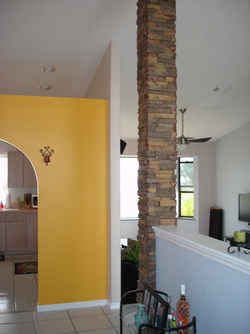 Decorative interior column covering an existing support in a home's living area