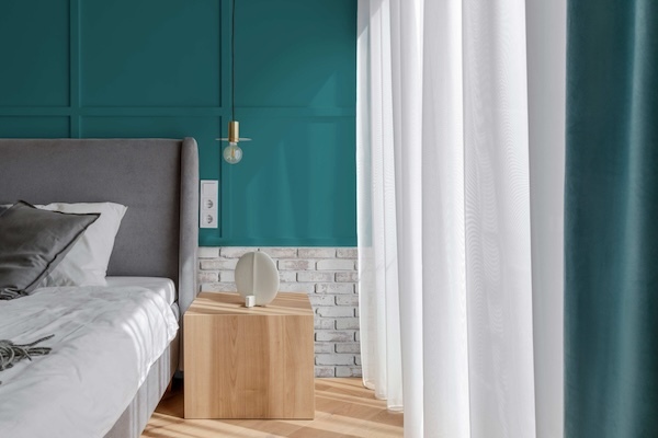 Old Chicago Faux Brick Wall Panels in Whitewash Brick as wainscoting on a bedroom wall