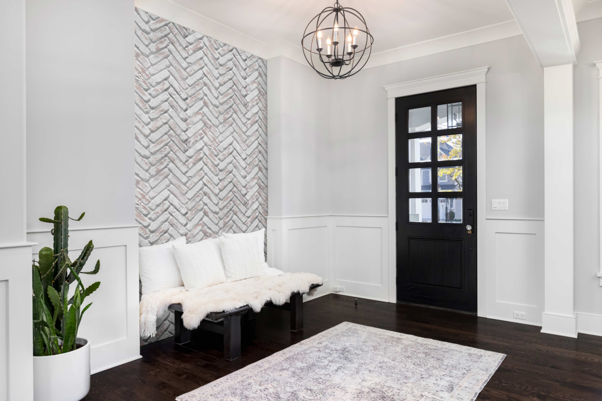 Old Chicago Herringbone Faux Brick Wall Panels in Whitewash Brick installed in an entry way